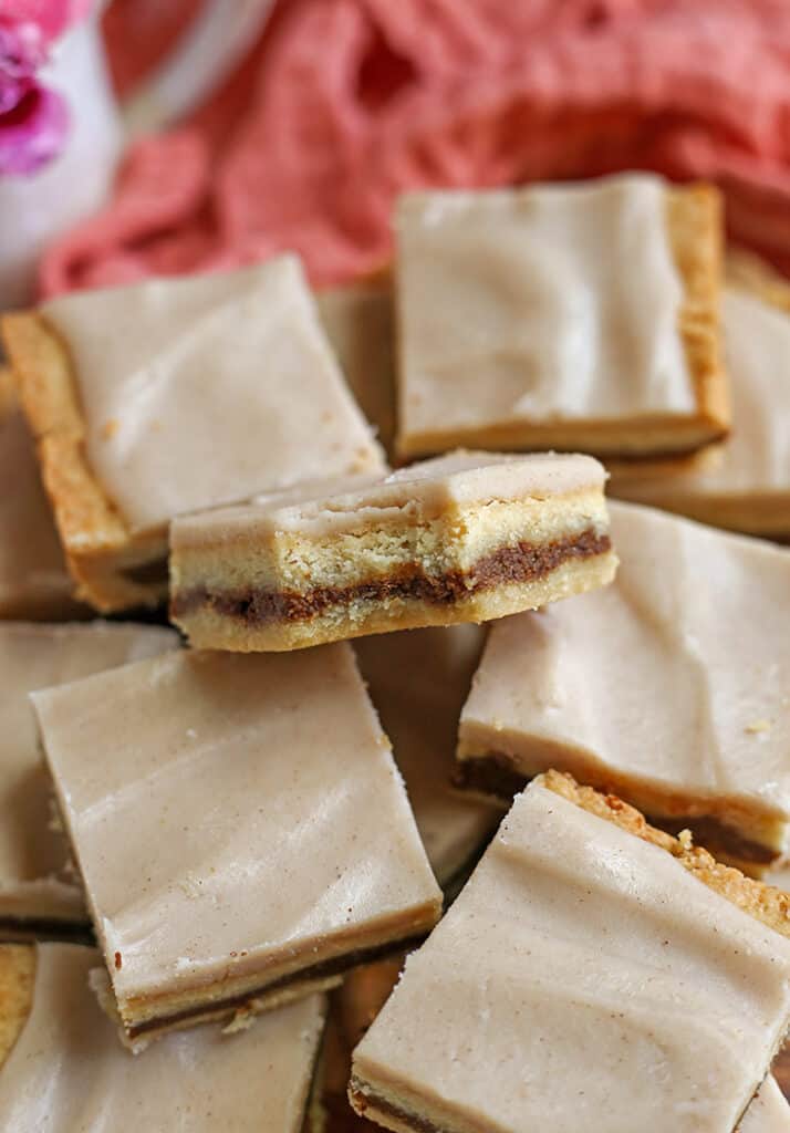 close up of paleo cinnamon pop tart bars with a bite taken out of one 