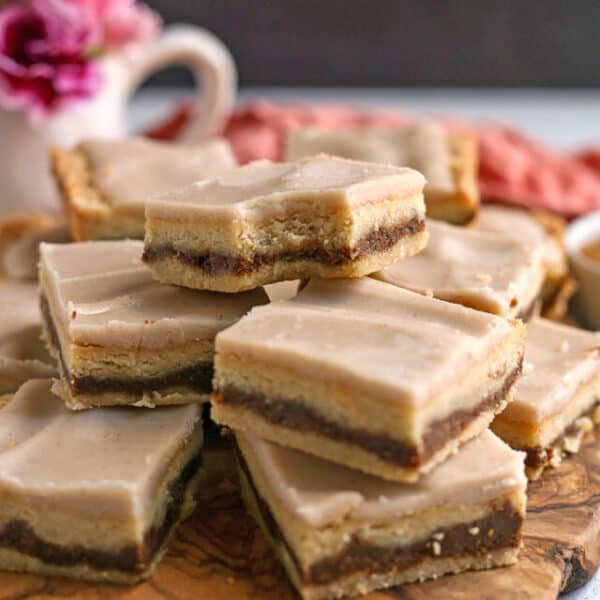 Brown Sugar Pop Tart Bars in a stack on a wooden board