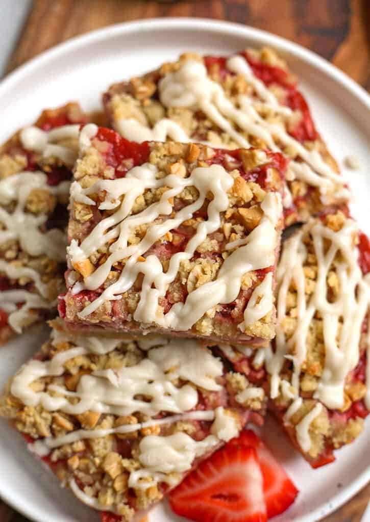 close up view of the top of strawberry rhubarb pie bars 