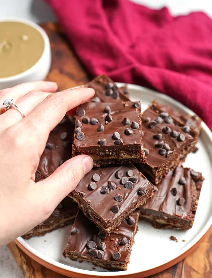 hand reaching for a paleo vegan double fudge bar