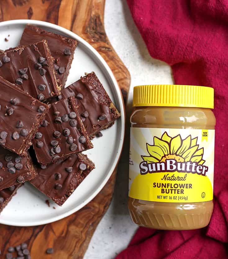 plate of vegan fudge bars with SunButter sitting next to it 
