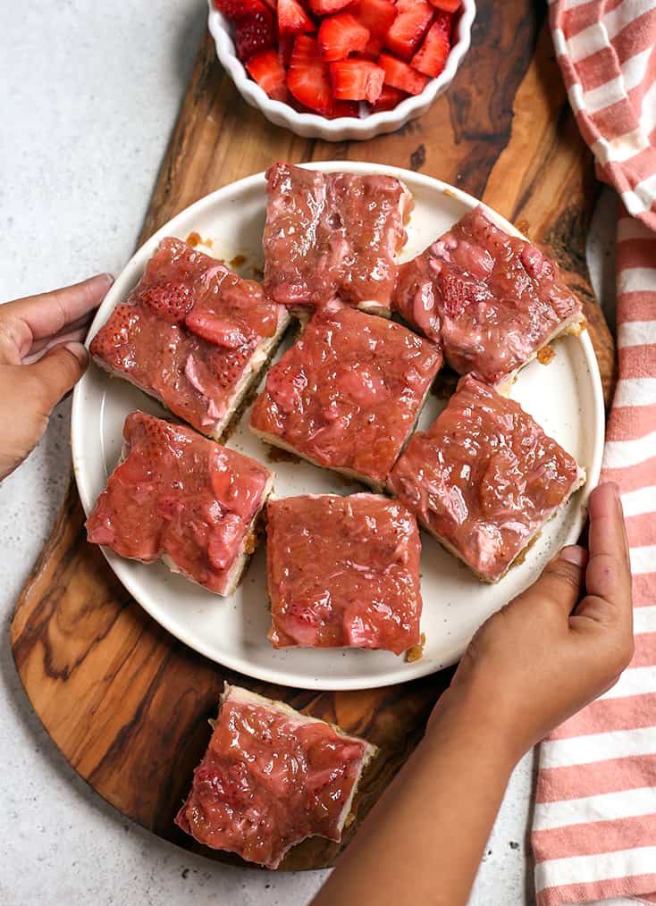 vegan strawberry cheesecake bars on a plate 