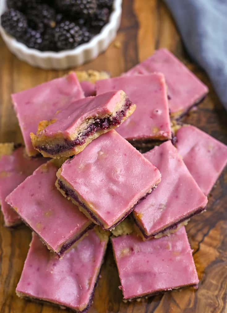 stack of paleo blackberry pop tart bars one with a bite taken out 