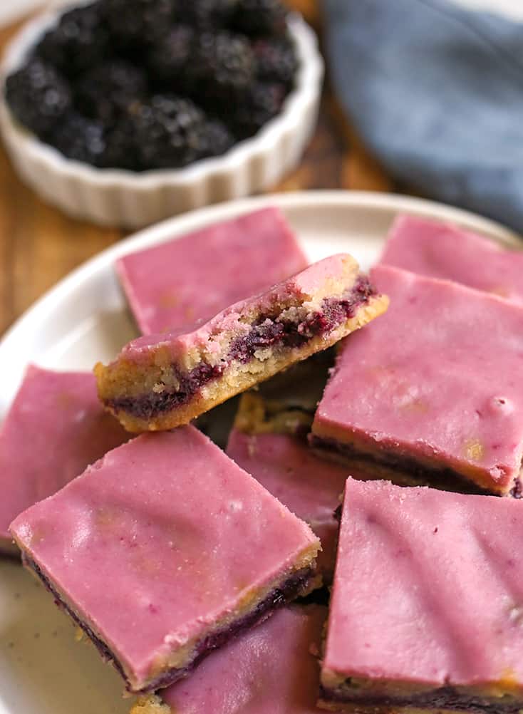 close up of paleo blackberry pop tart bars with a bite taken out of one