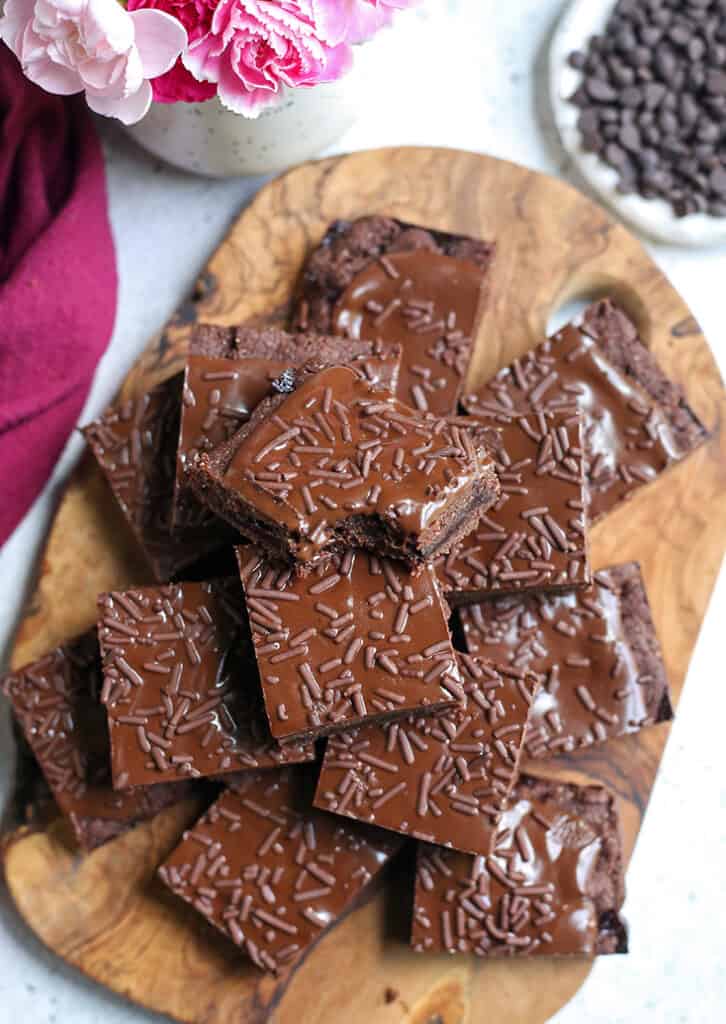 paleo vegan chocolate fudge pop tart bars stacked on a cutting board