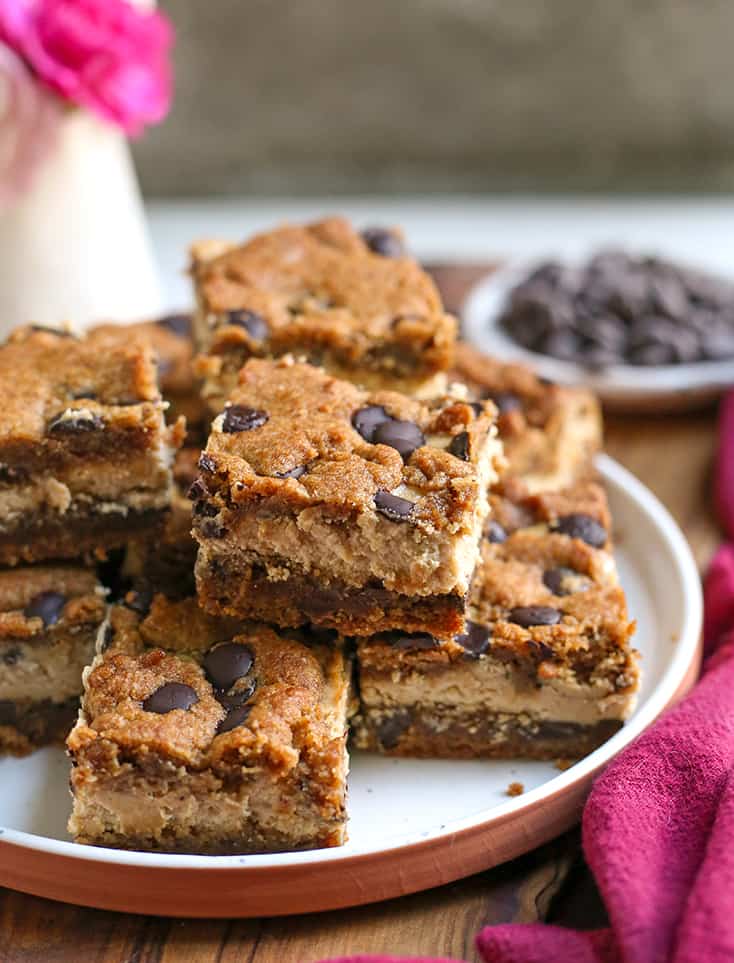 a stack of gluten free chocolate chip cookie bars on a plate 