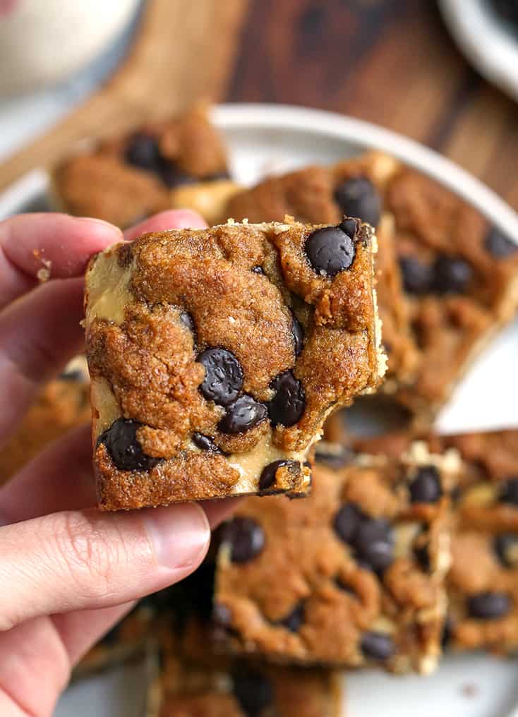 hand showing the top of the grain free chocolate chip cookie bars 