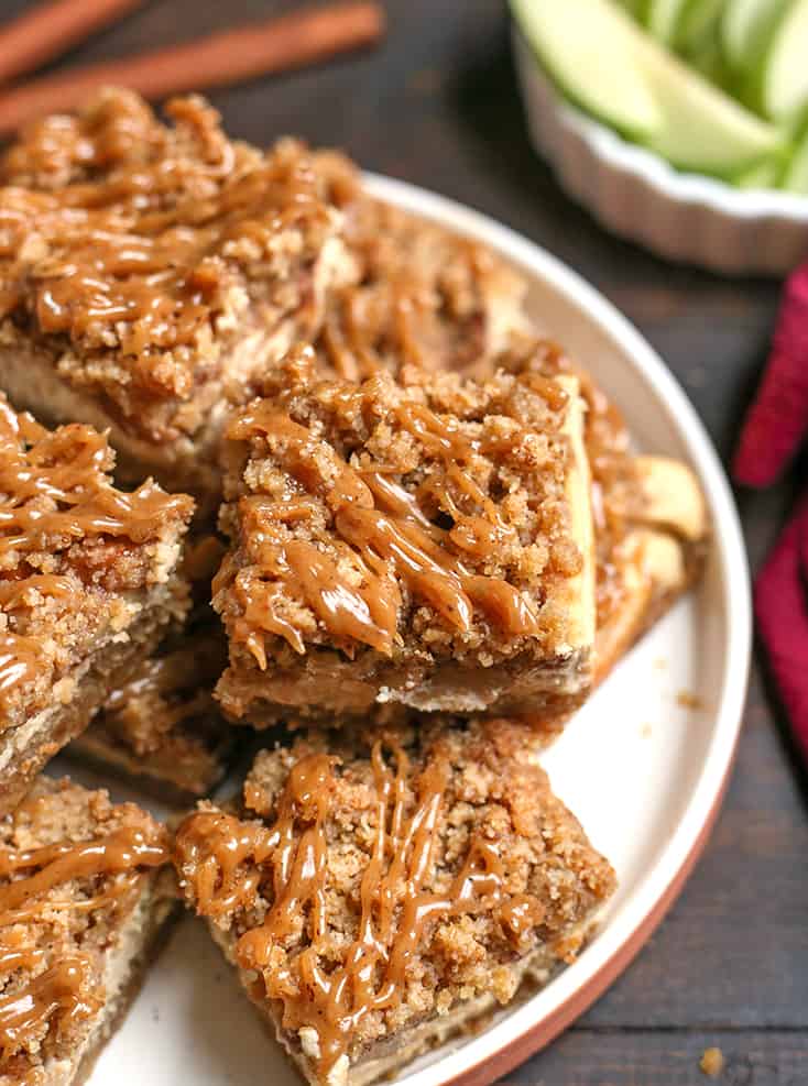 plate of grain free caramel apple cheesecake bars 