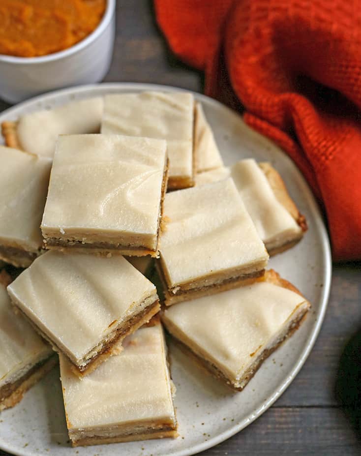 a plate stacked with vegan pumpkin pop tart bars 