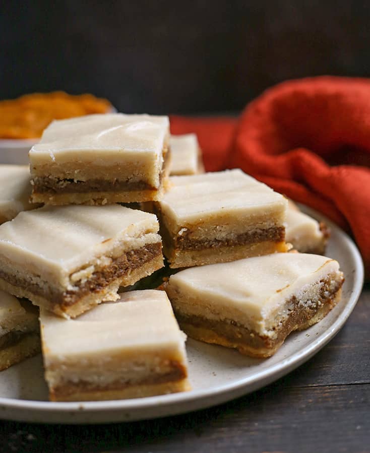 a side view of a plate stacked with paleo pumpkin pop tart bars 