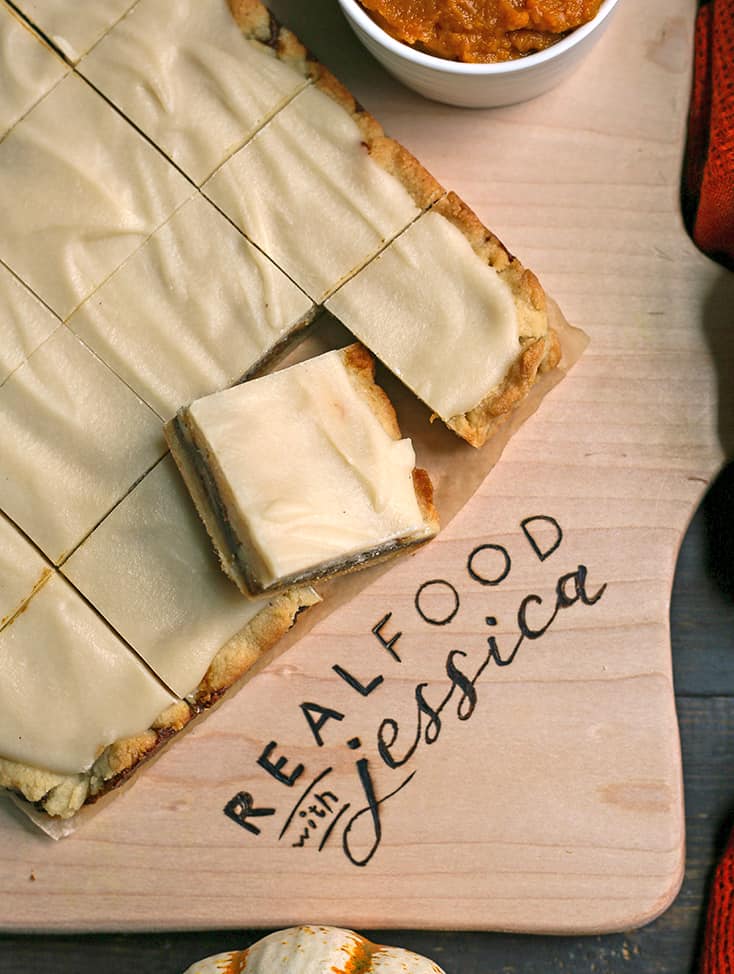 a cutting board with pumpkin pop tart bars on it, cut 