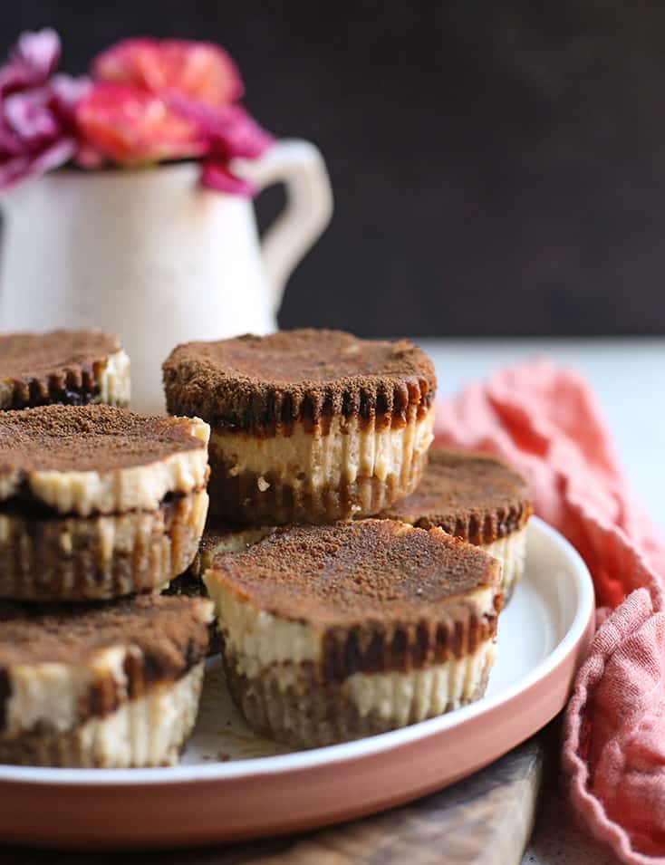 paleo cinnamon roll cheesecakes stacked on a plate 