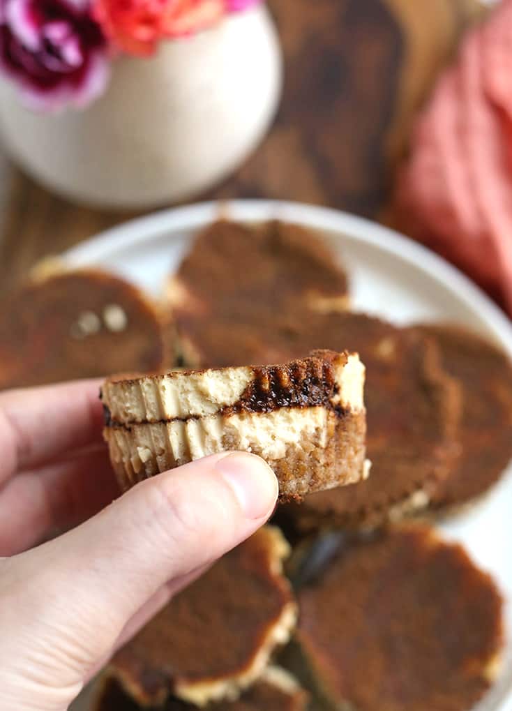 hand holding a grain free mini cinnamon roll cheesecake 