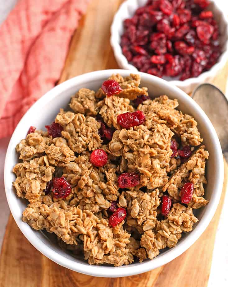 bowl of big cluster granola with cranberries 