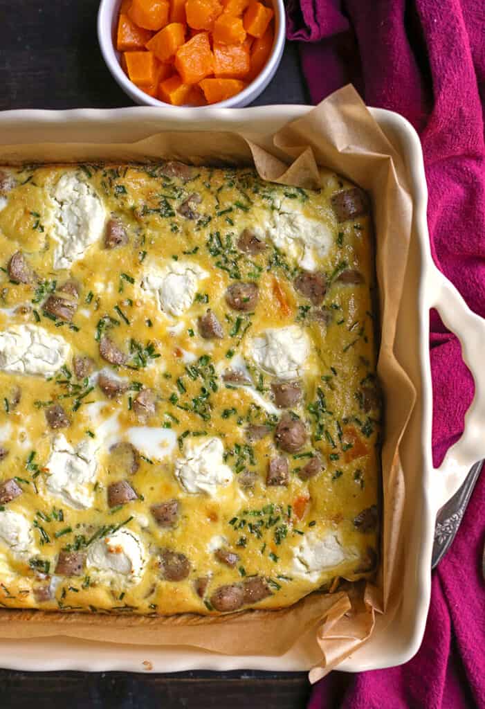 top view of goat cheese egg bake in a baking dish 