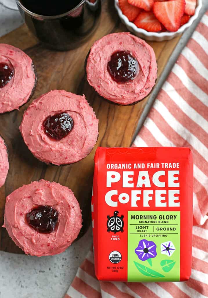 peace coffee next to chocolate cupcakes 