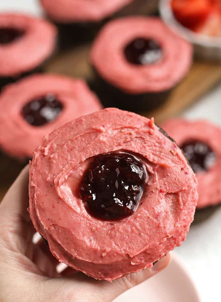 top view of gluten free chocolate cupcakes with strawberry frosting