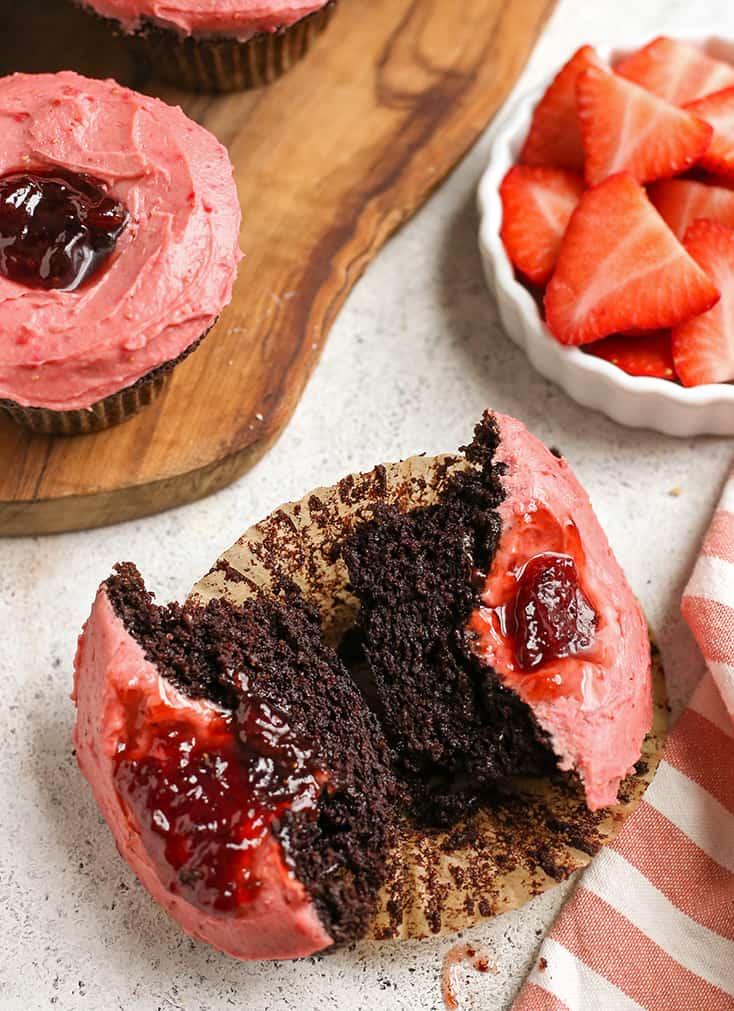 grain free chocolate cupcake cup with the berry frosting shown 