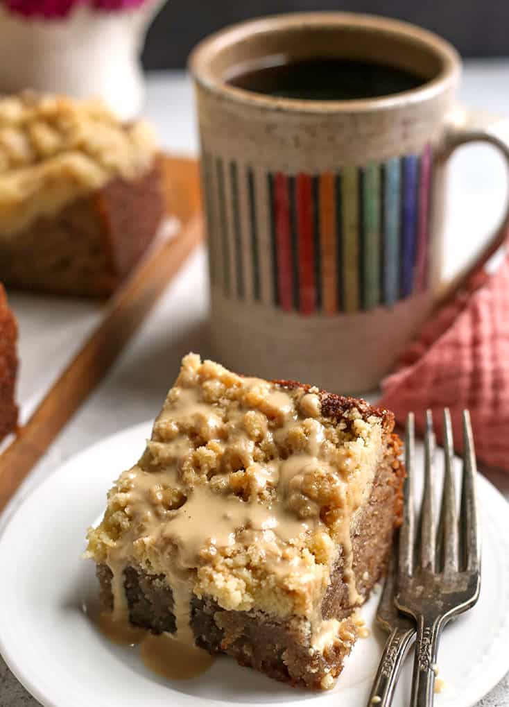 a plate with a piece of paleo raspberry coffee cake 