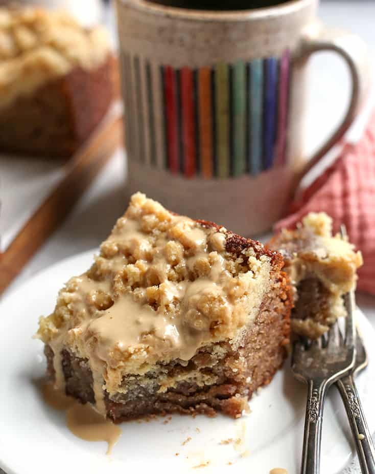 a bite taken out of paleo raspberry coffee cake