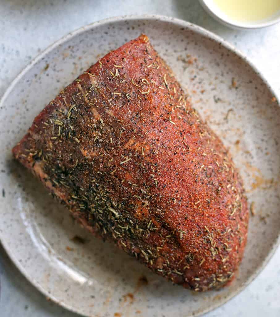 raw roast beed rubbed down in the seasonings 