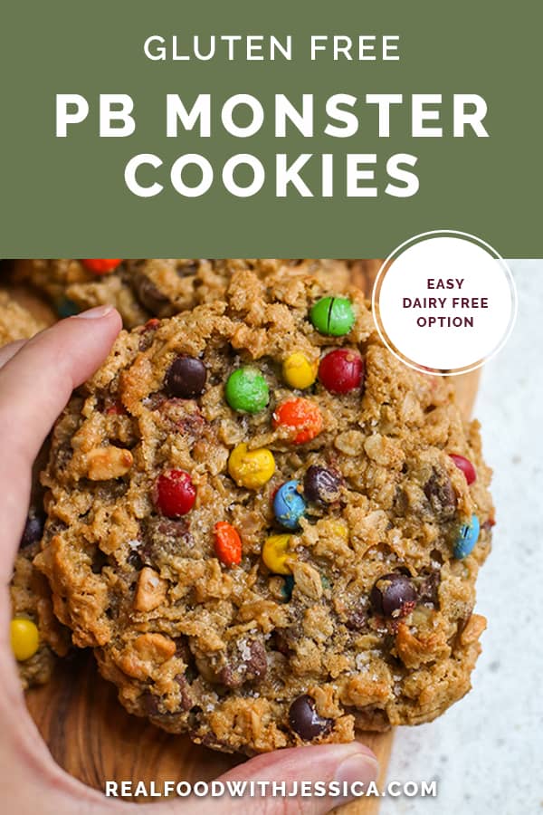a hand grabbing a monster cookie with text on it. The cookies name along with the website. 